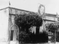 La casa del Fascio divenuta Casa del Popolo, con l’immagine di Palmiro Togliatti